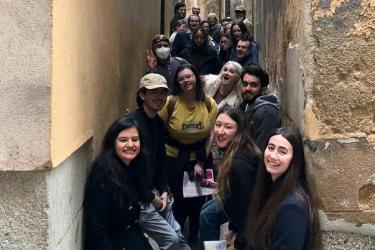 Students standing in an old alley