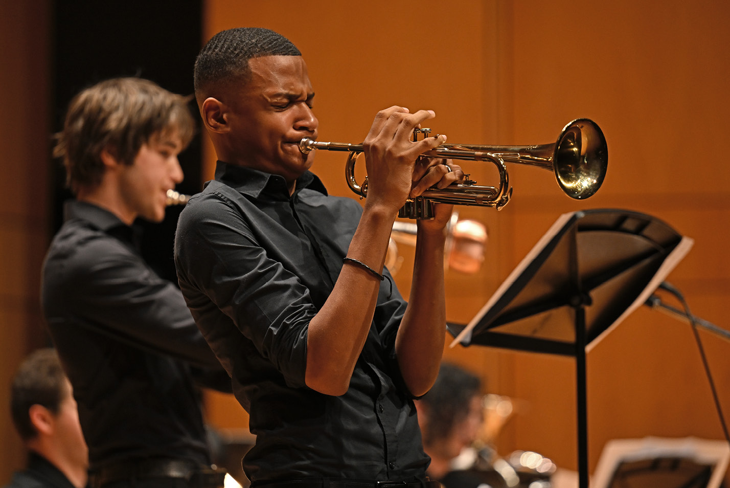 Trumpeter blows during a student orchestra event at Fall Weekend 2024