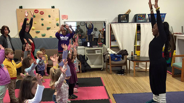 A Human Development student leads a group of local children in a hands-on lesson.