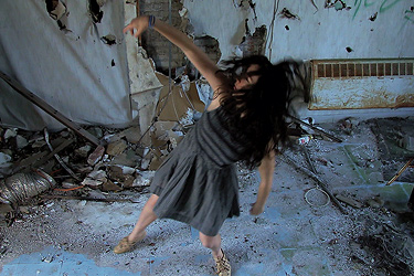 Still image of woman dancing from student film, Alice, by George Scarles ’15