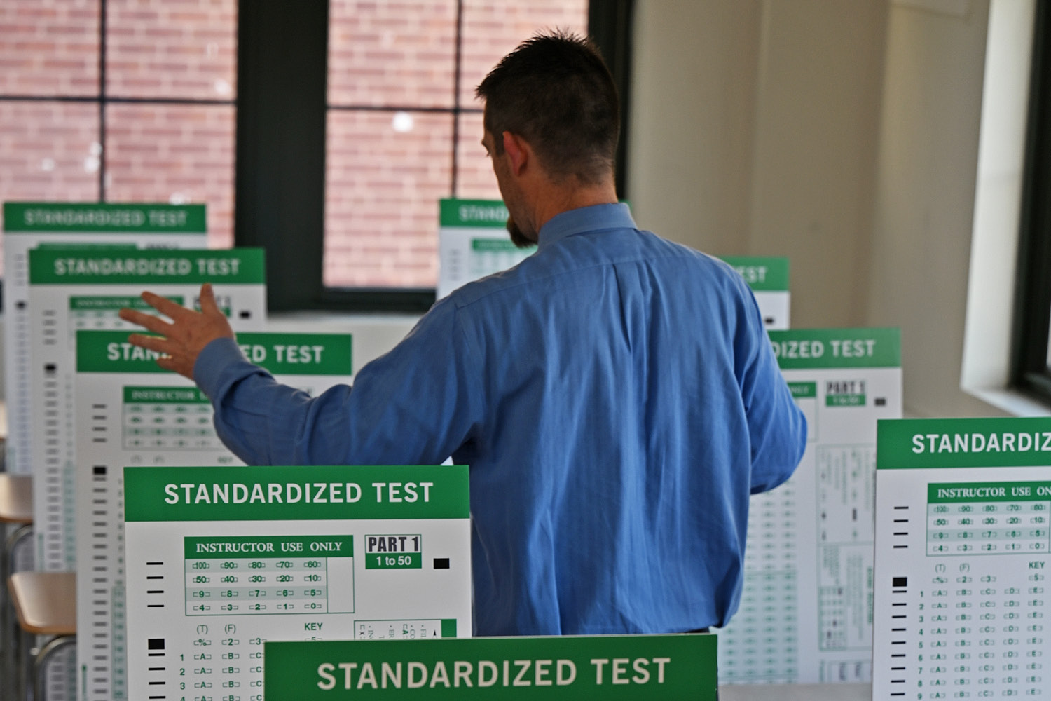 Conceptual image of teacher teaching to a bunch of tests