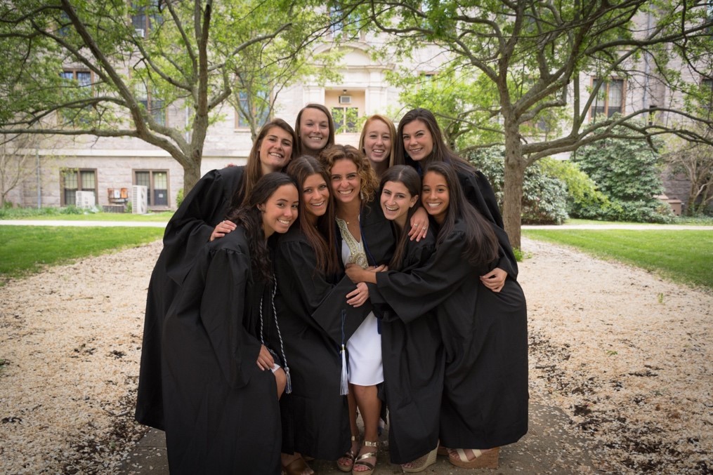 Women Soccer graduates posing on graduation day