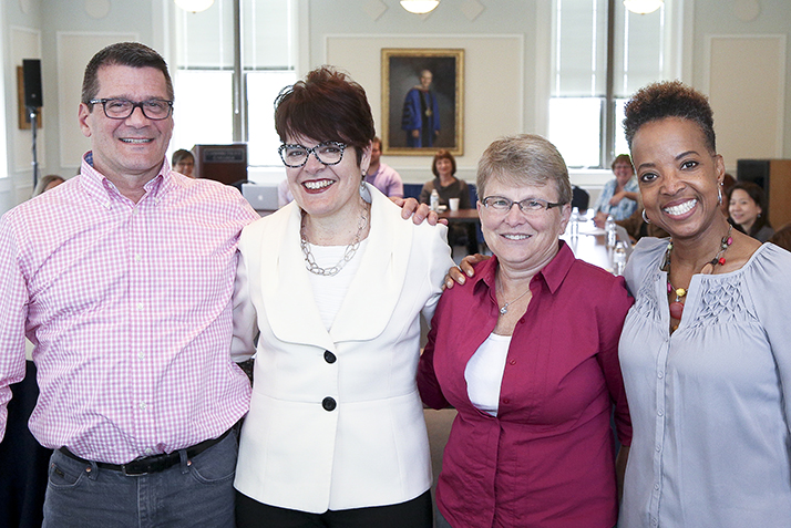 Cheryl Banker poses with President Bergeron, Noel Garrett and Persephone Hall