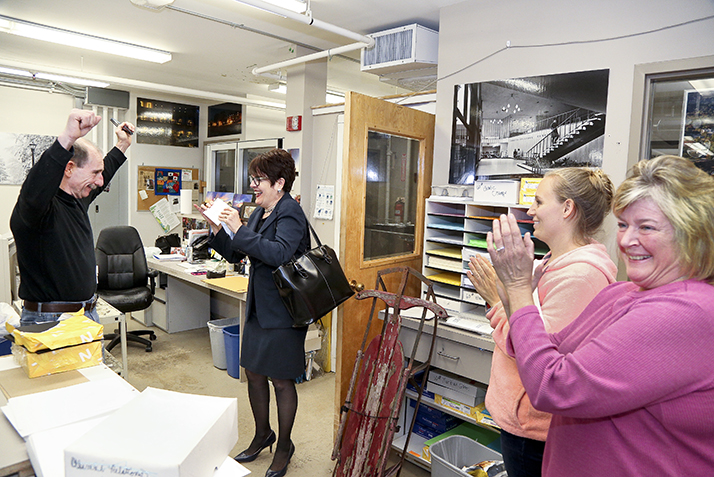 Printing and Mailing Services staff react to winning the team award. 