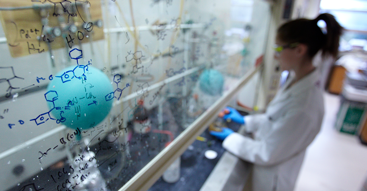 A student conducts an experiment in a science lab 