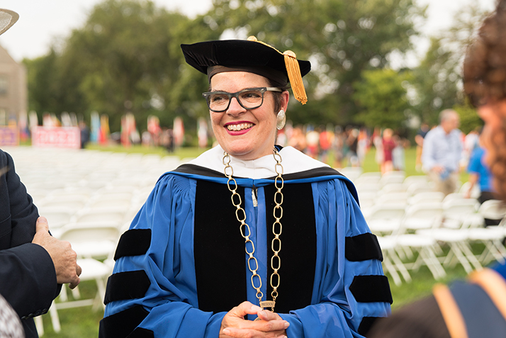 President Katherine Bergeron speaks with faculty before the beginning of Convocation. 