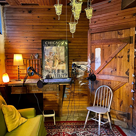 Podcast equipment set up in Professor Mara Suttmann-Lea's cozy home office space. 