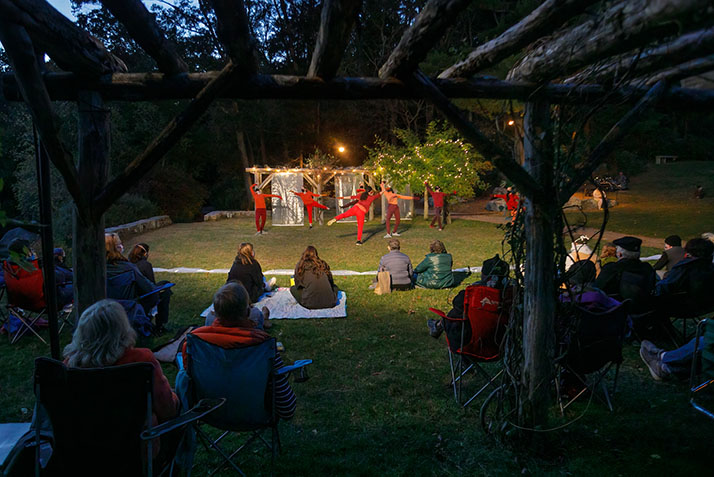 Dancers perform Reach, a work choreographed by Lisa Race, in the Arboretum.