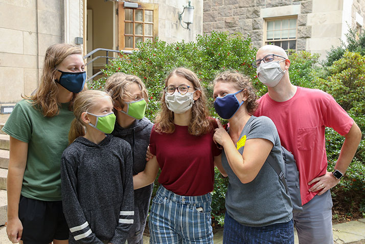 A student poses with her family members