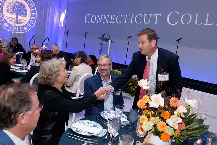 Rob Hale '88 P'20 greets fellow alumni.