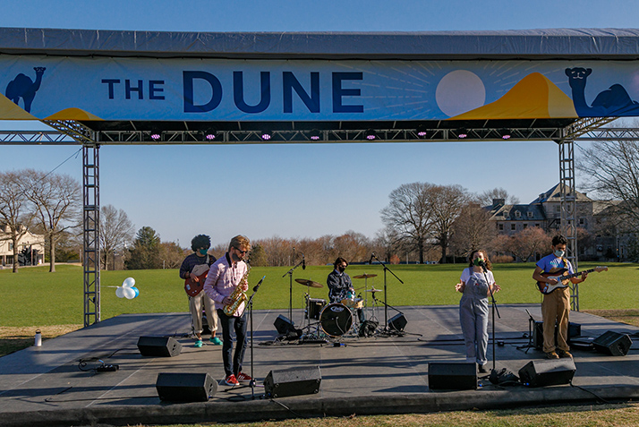 Teal Darts performs on The Dune at Founders Day. 