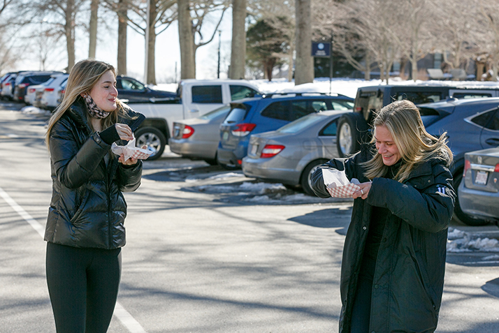 Students enjoy food from the food trucks