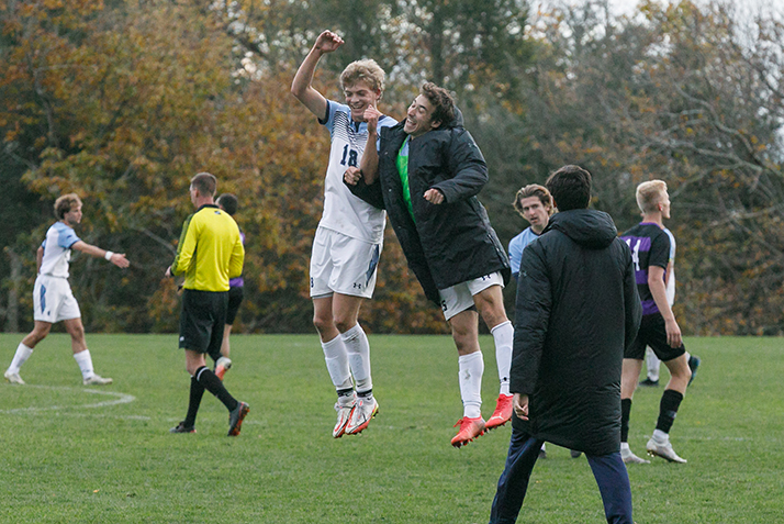 Players celebrate the win. 