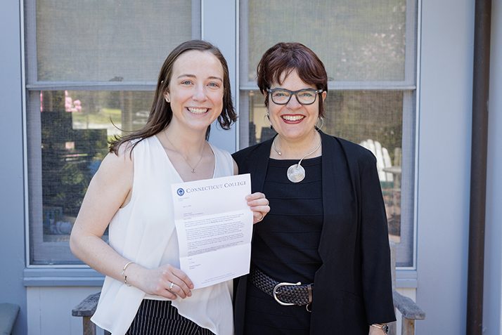 President Katherine Bergeron, right, congratulates Ashlyn Healy '20