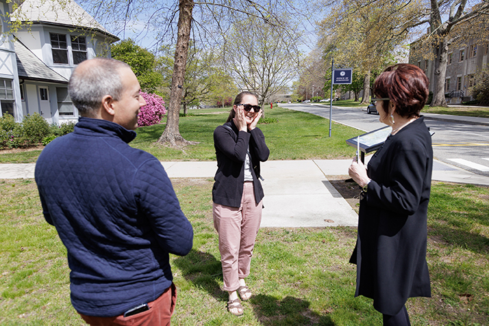 Rich Madonna and Katherine Bergeron surprise Margaret Bounds with a staff award.