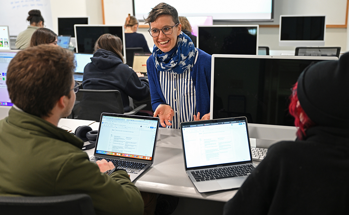 Visiting Assistant Professor of Education Karen Pezzetti works with students in her “EDU 313: Children, Books & Culture” class.