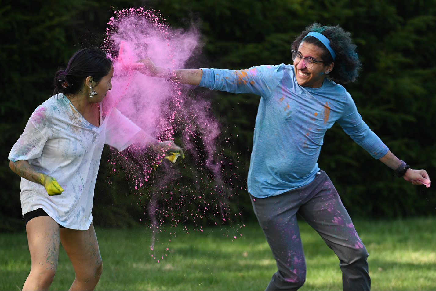 Students playing at a celebration of Holi, the Hindu festival of colors Friday, April 14, 2023.