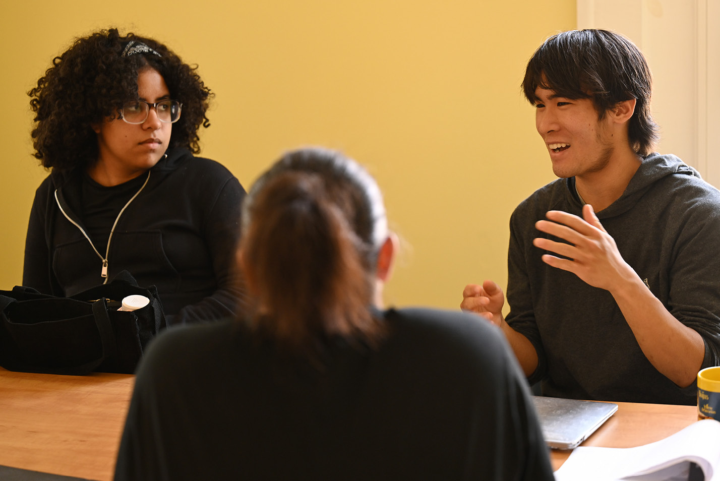 Civic Leaders students Kevin Lieue ‘26 and Danisha Then ‘25 meet with staff of the New London Homeless Hospitality Center Wednesday, June 21, 2023 at the HHC’s resource center.