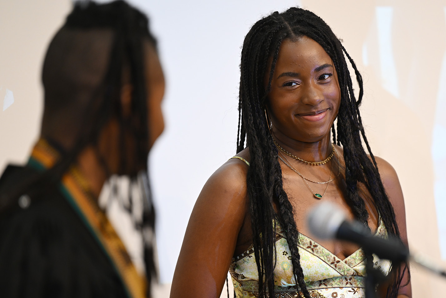 Prof. Shani Collins, Mentor Posse 11, offers comments to Posse Scholar Zion Martin-Hayes, right at the Posse graduation celebration Saturday, May 20, 2023