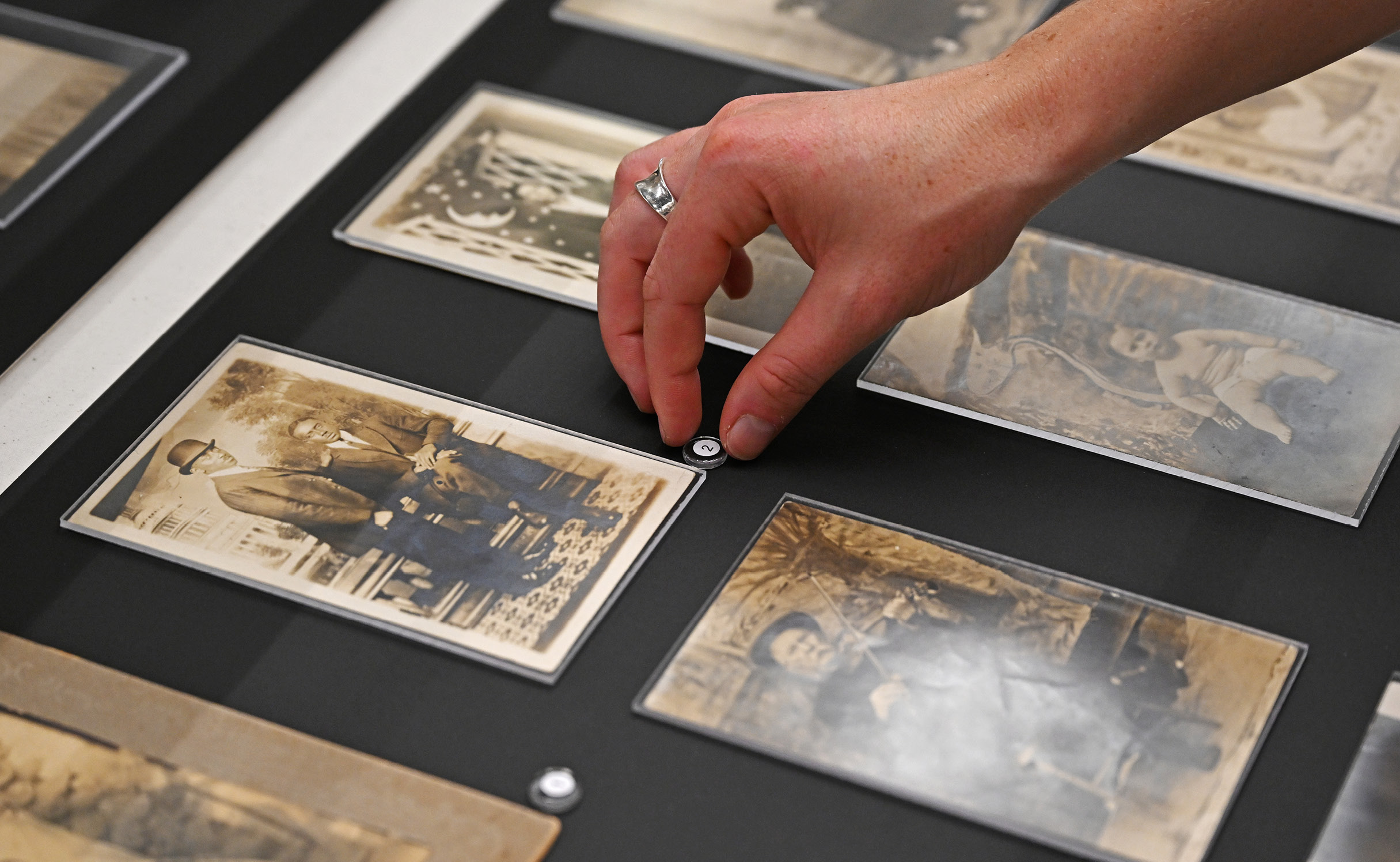 Students installing historical photos