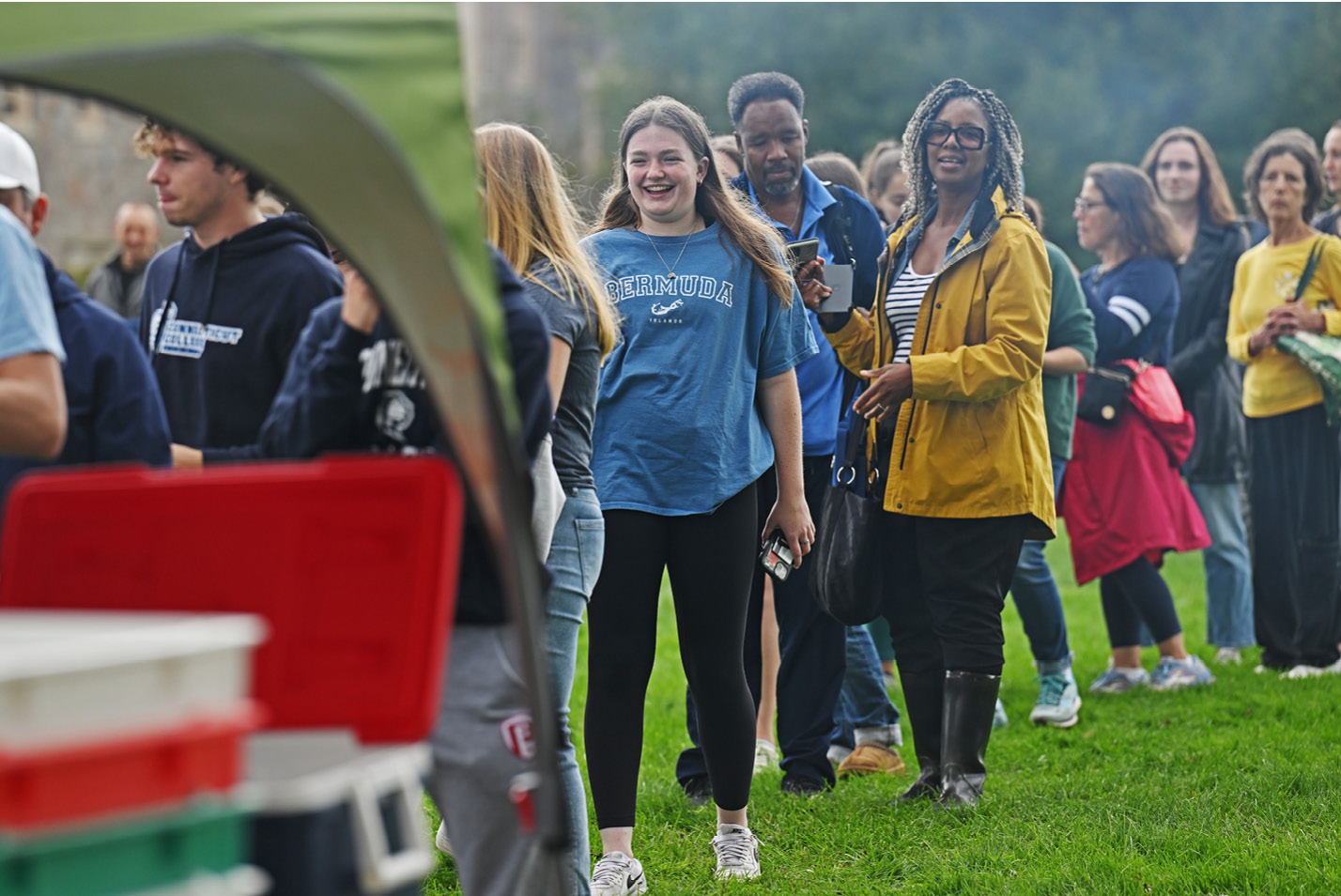 Alumni and parents wait in line for food at Fall Weekend 2023.