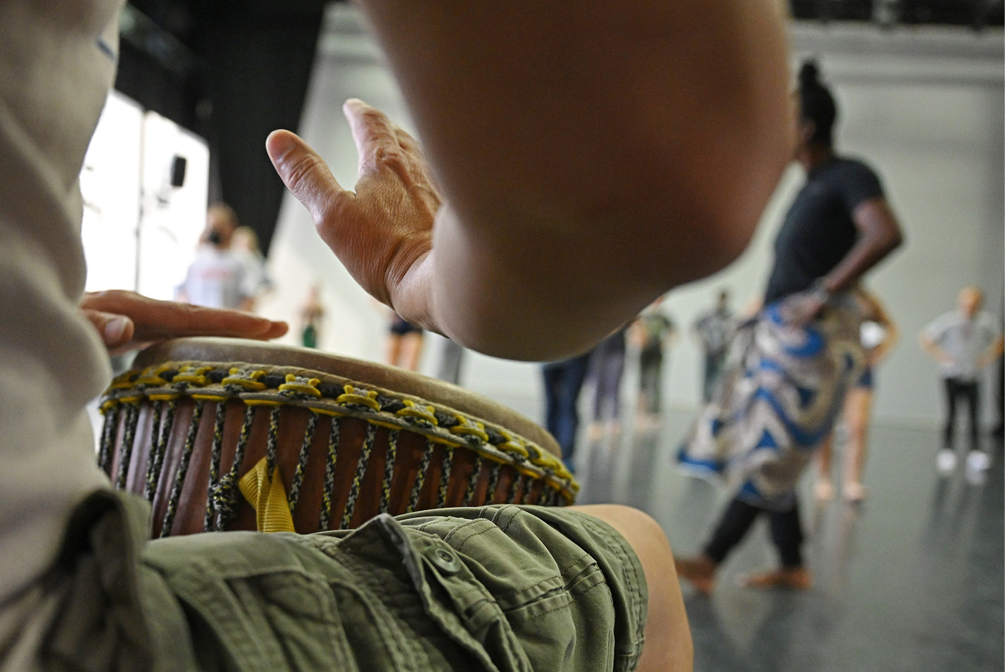 Close-up of a drummer in Associate professor of dance Shani Collins-Achille’s West African Dance class.