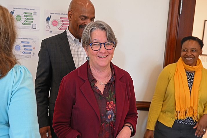 Deb Brunetti, Associate Director of Advising in the Hale Center for Career Development, is surprised with a staff award.