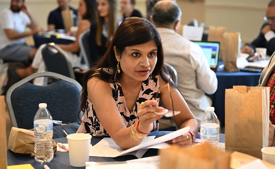 Bharti Chhibber, portraying Sen. Richard Durbin (D-Illinois) makes a point to her group during the United States Department of State Study of the United States Institutes (SUSI) foreign policy program hosted by MaryAnne Borrelli, Susan Eckert Lynch ’62 Professor of Government, Thursday, July 13, 2023 in the 1941 Room.