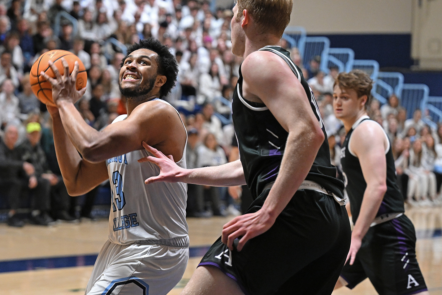 Basketball player makes moves to hoop