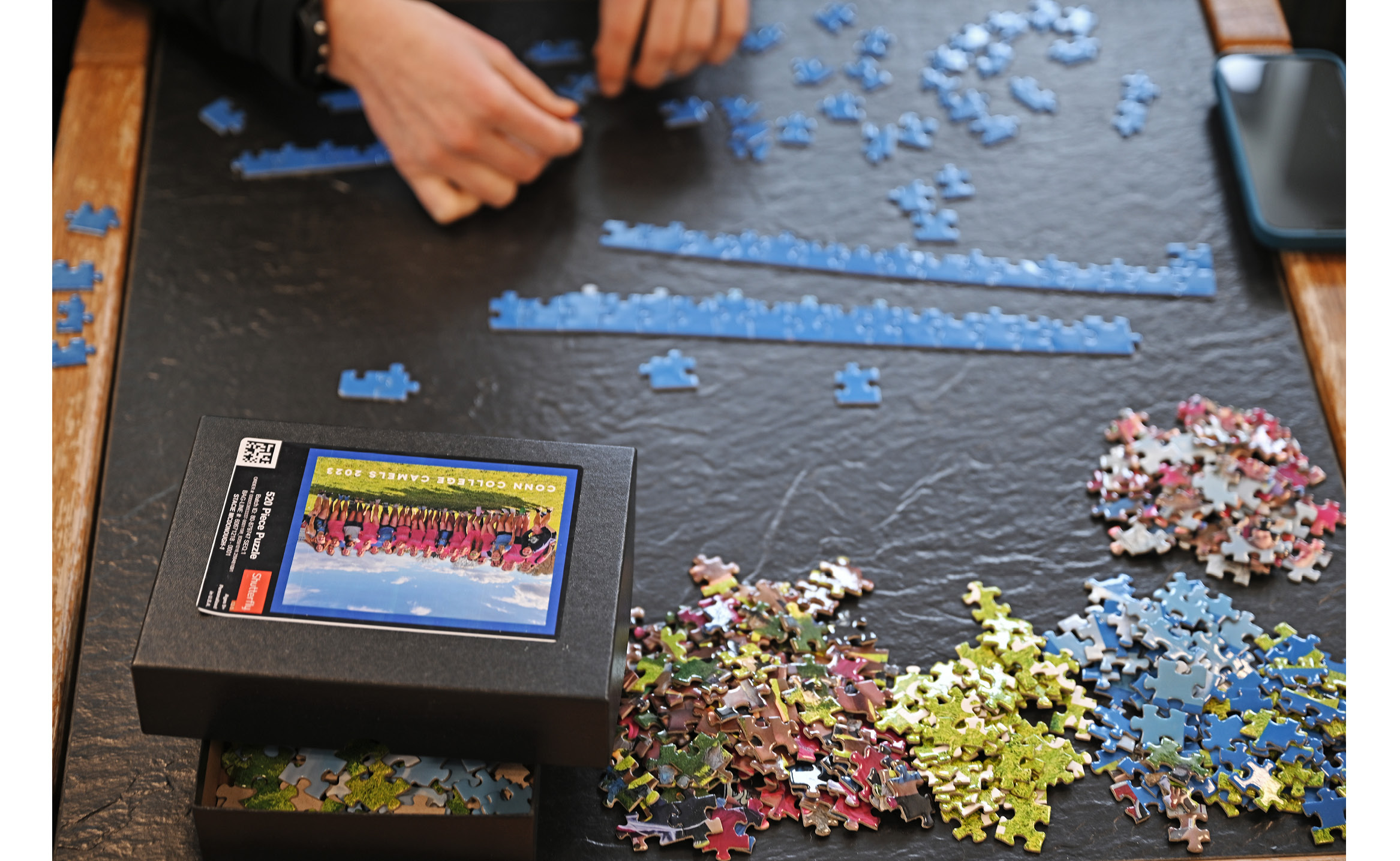 Overhead shot of student doing a puzzle