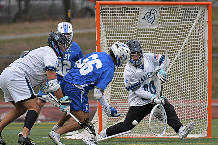 men's lacrosse goalie makes a save