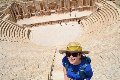 Arabic studies student at the Roman theater ruins in Jerash, Jordan 